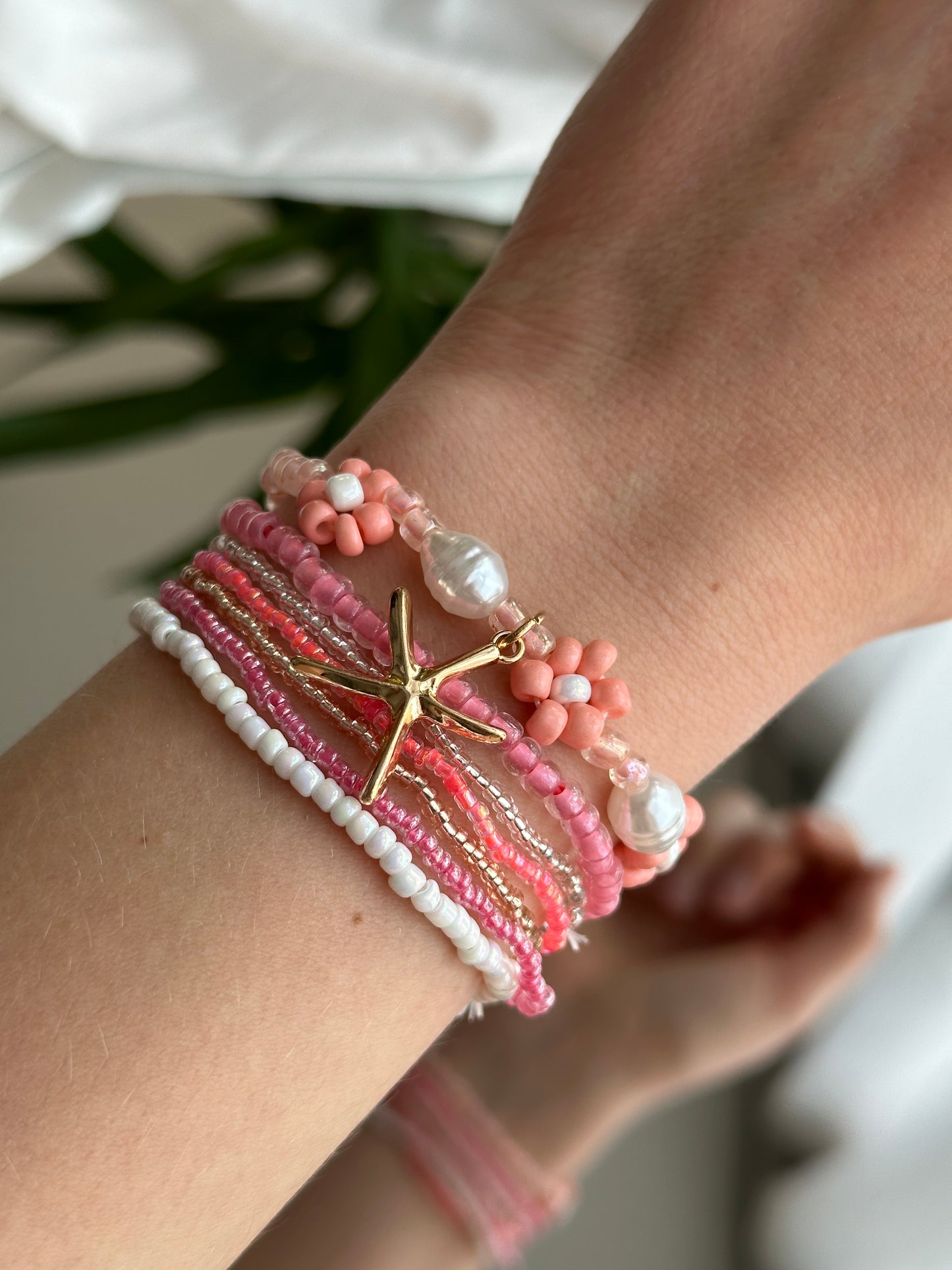 Conjunto de pulseras playa rosa