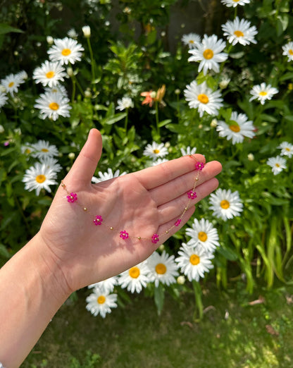 Collier petites fleurs fushia