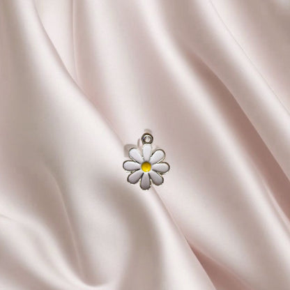 Fleur rose clair centre jaune- Charm