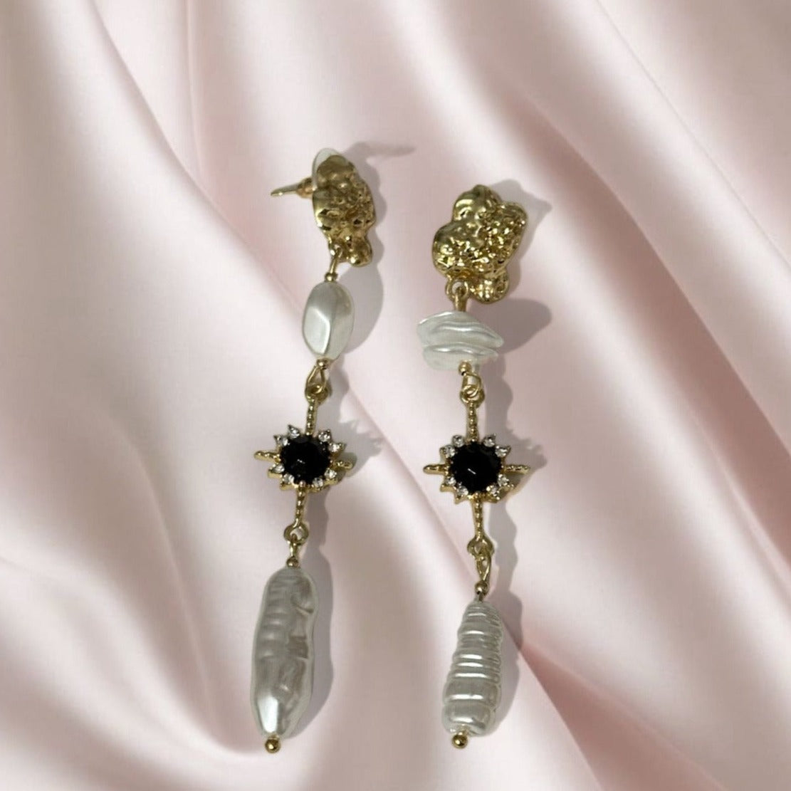 Pair of dangling pearl earrings